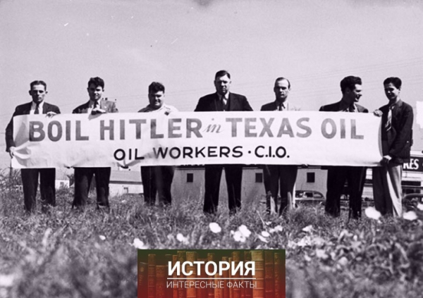 Члены профсоюза нефтяников демонстрируют плакат с надписью..0